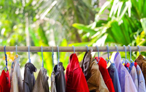 Clothes,On,Hanger,Hanging,To,Dry,On,Clothesline,With,Blurred